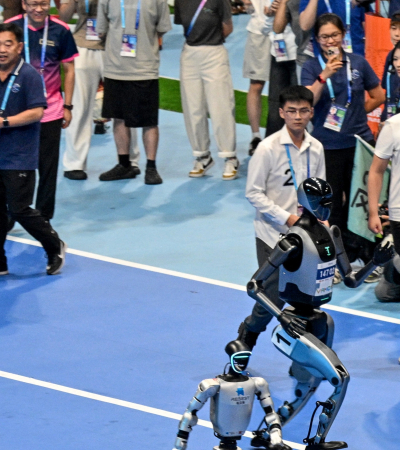 Humanoïde robots tijdens een 100 meter sprint. Foto: Adek Berry/AFP/ANP