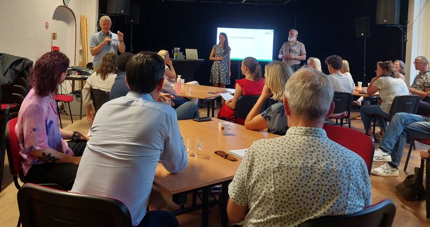 Bezoekers van de bijeenkomst in Breda