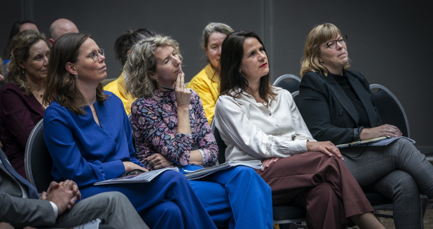 Publiek bij symposium HNEM